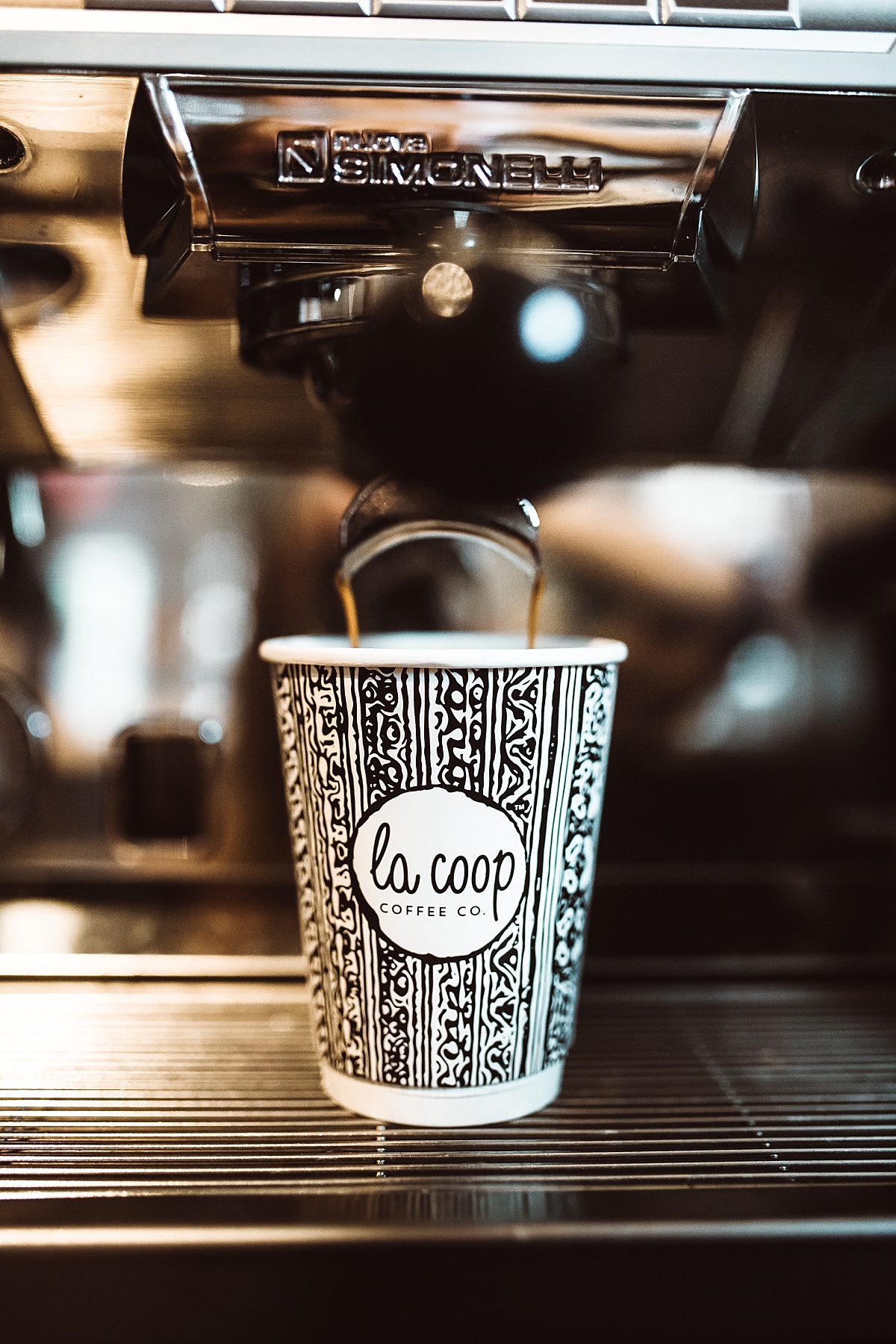 drip coffee pours into a cup at la coop coffee