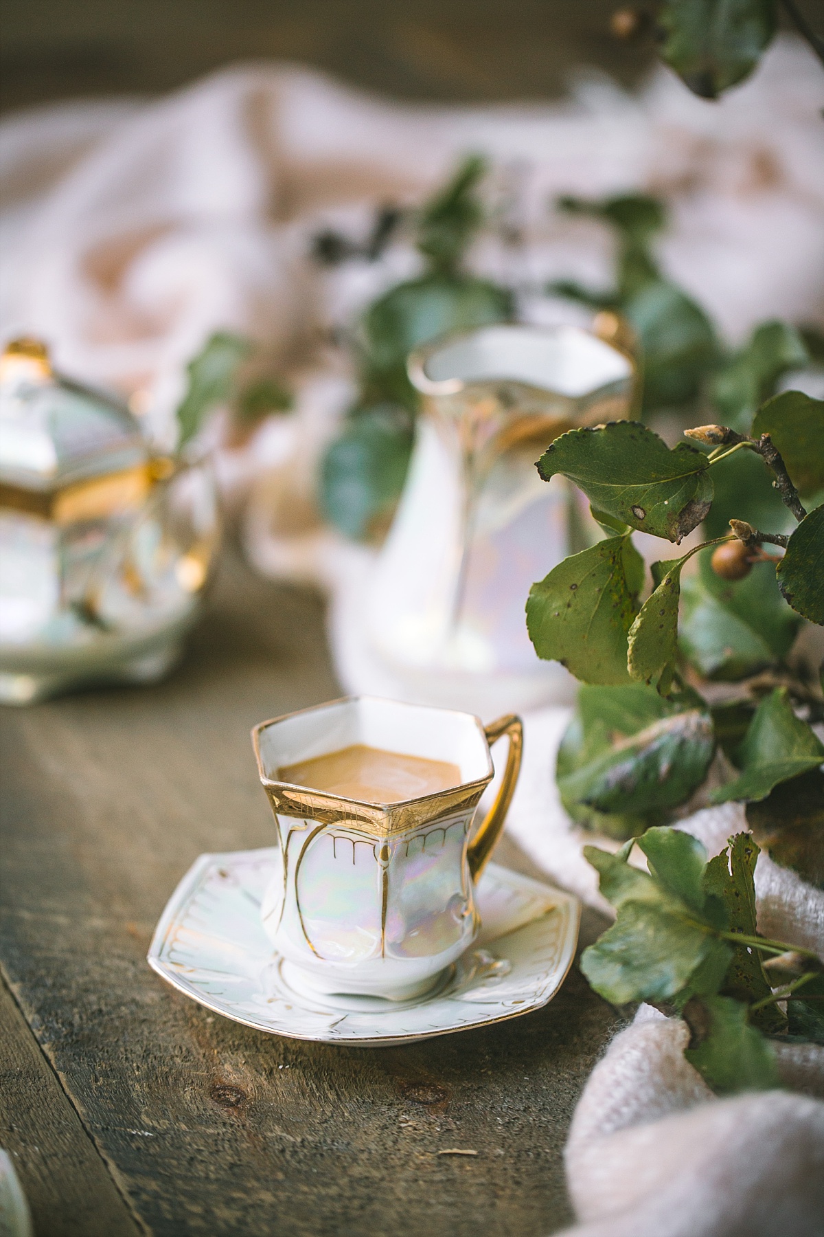 gorgeous czech heirloom gold plated china coffee cups alongside apple tree leaves