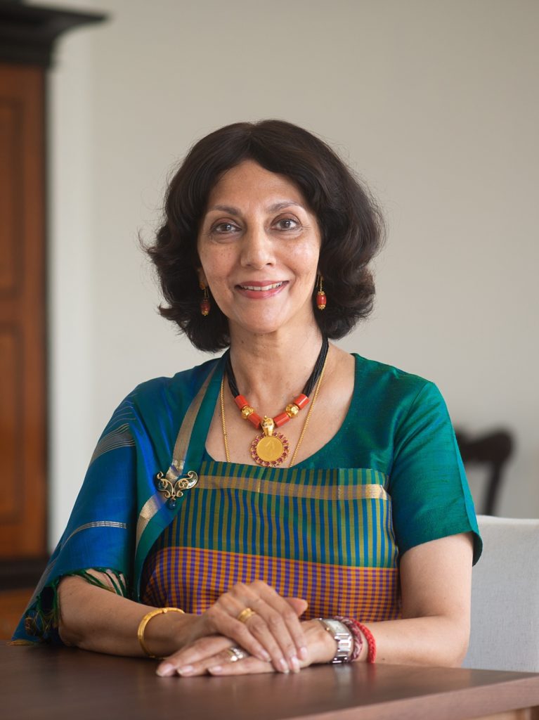 kaveri ponnapa author of the vanishing kodavas in a teal, royal blue, red, and gold sar