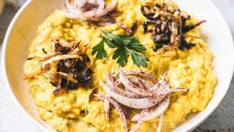 golden musalwa'a or mujadarah safra topped with caramelized and sumac onions
